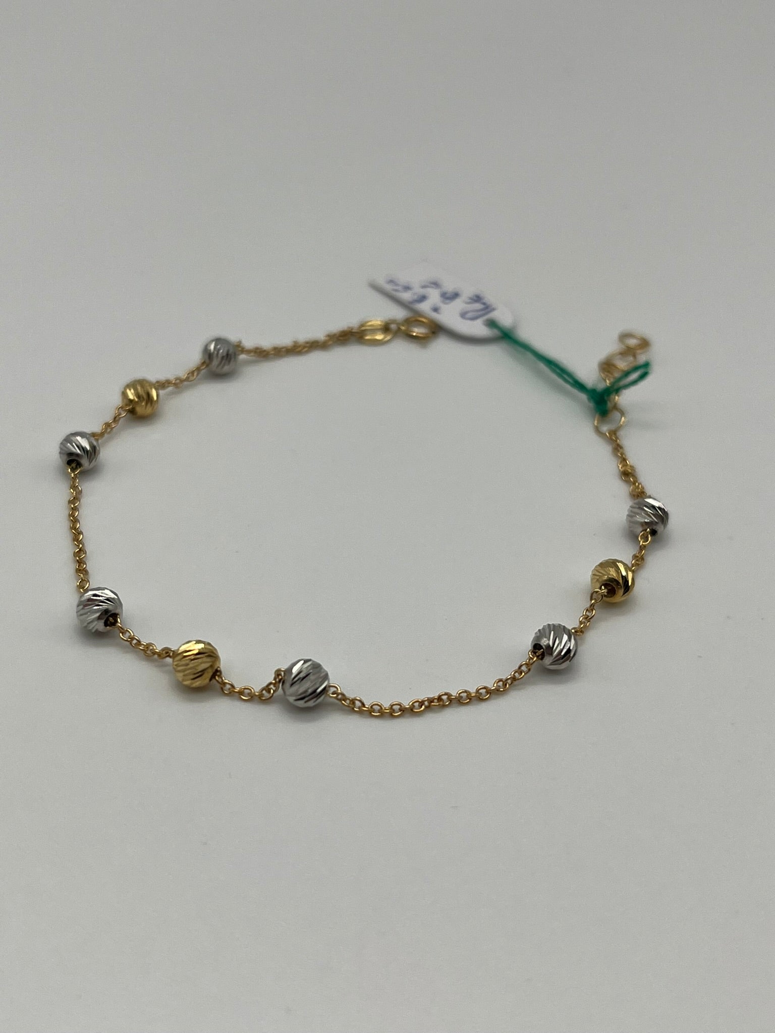 Bracciale bicolore in oro 18kt con dettagli sferici