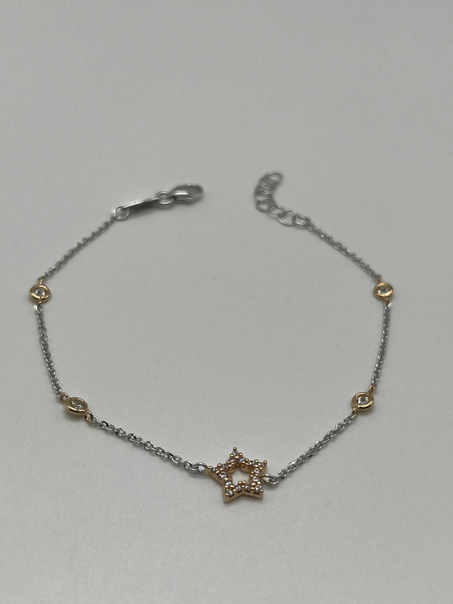 Bracciale in oro bianco 18kt con punti luce e stella rosè